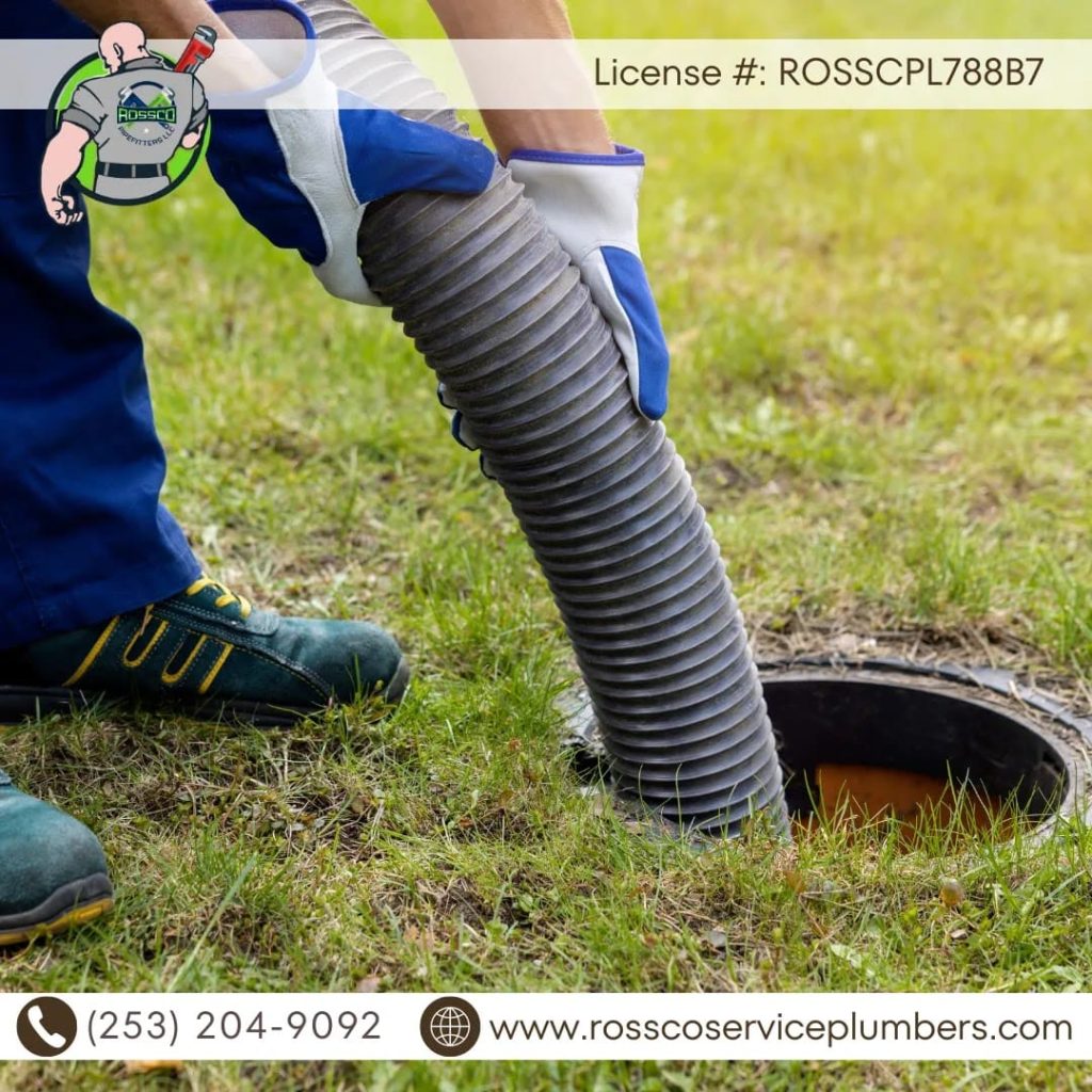 Person using a drainage hose outdoors